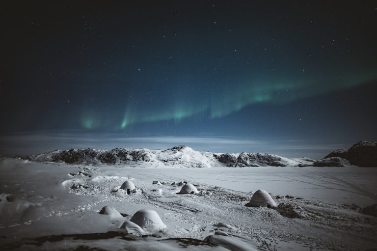 Northern lights over snowy Greenland